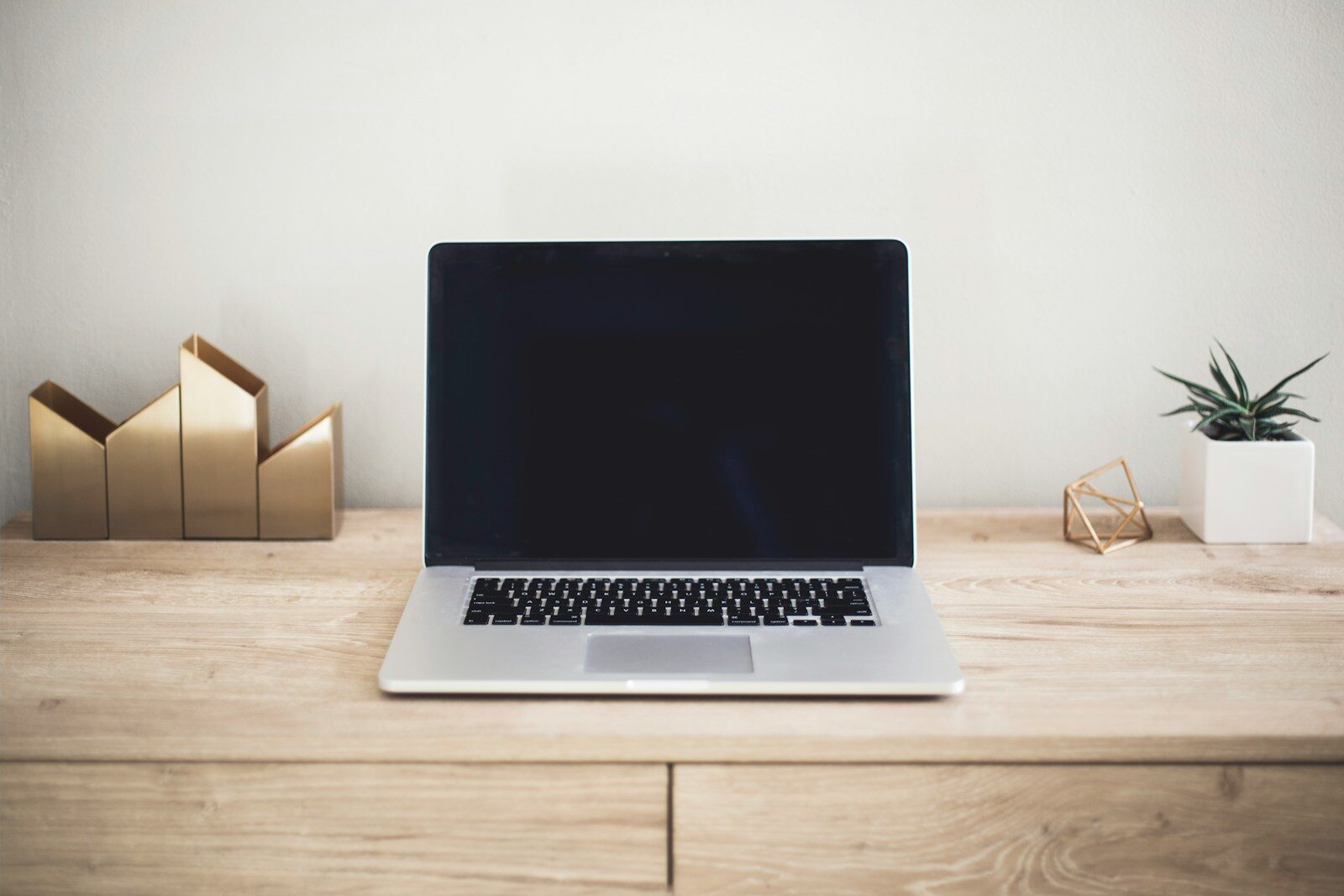 Laptop on a home desk used for remote work