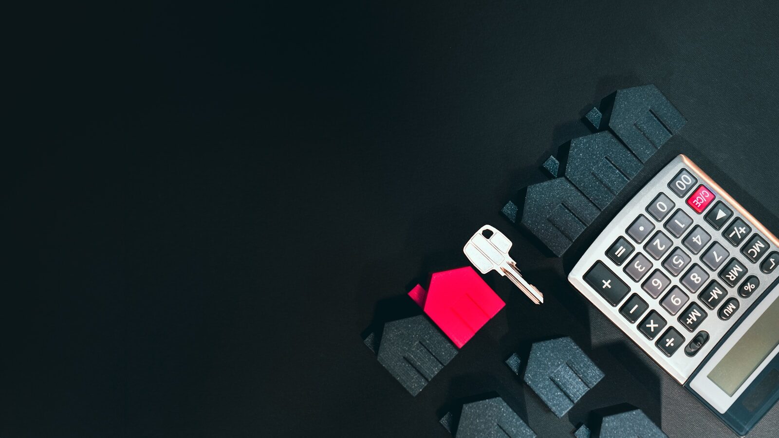 House keys resting beside mortgage application documents