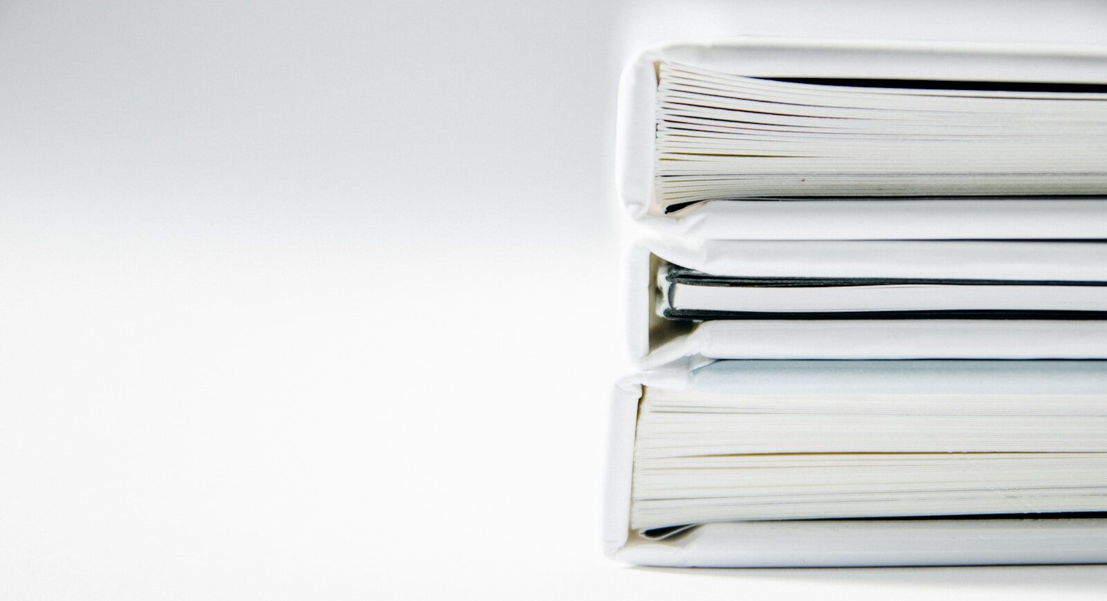 Printed business reports and charts arranged on a desk